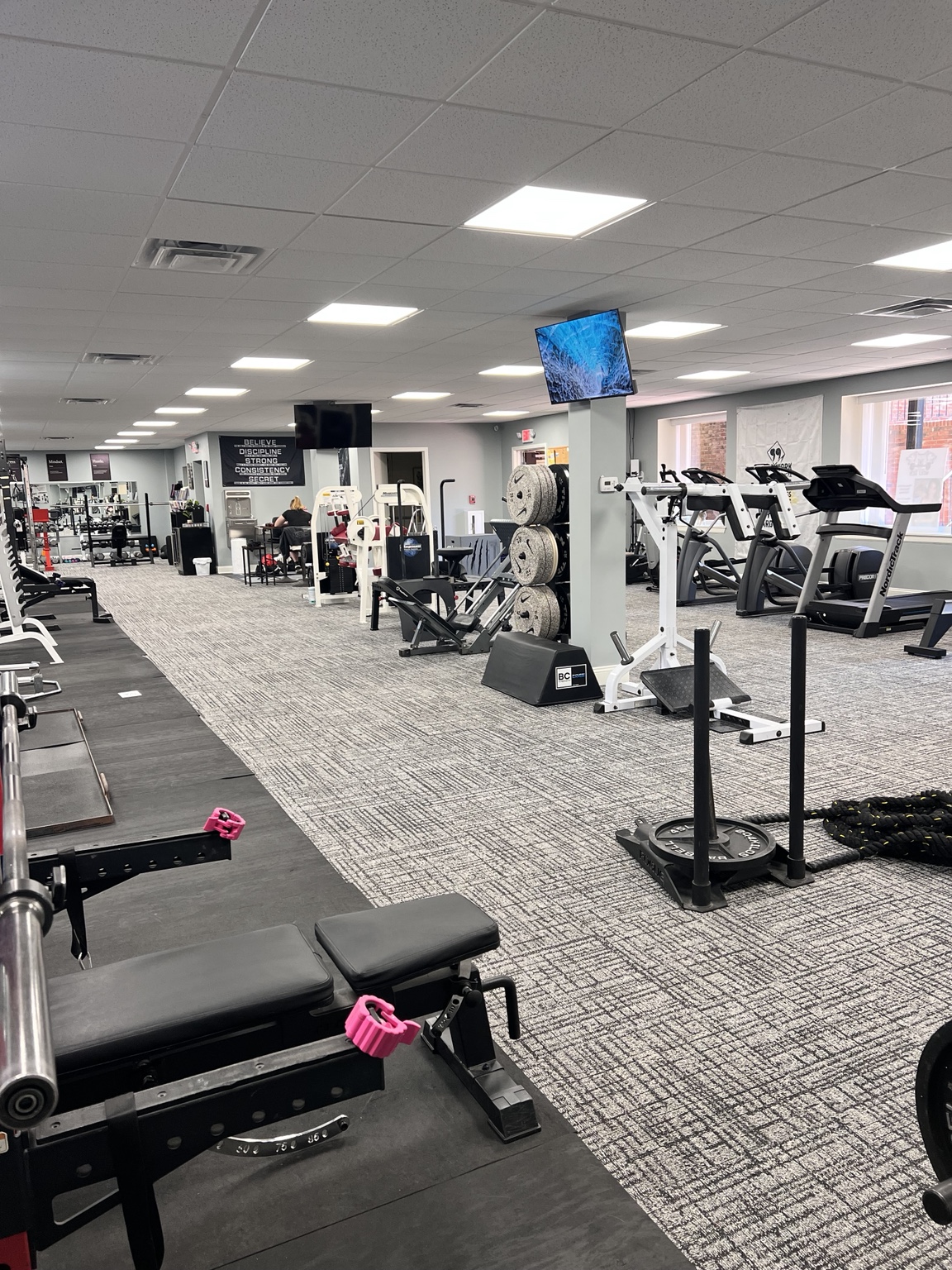 Strength and cardio equipment across the Wolf Den gym floor